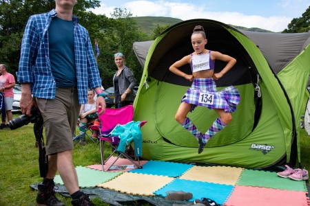 Young Highland Dancer warms up for competition