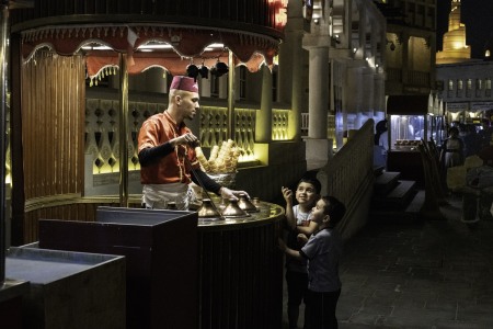 Two boys buy ice-cream