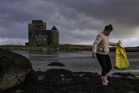 Young volunteer takes part in a beach clean for the charity Project Trust